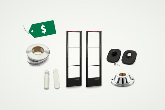 A complete retail security system: a pair of Ebony II towers, security tags with a pin, pencil tags, a label roll and a magnetic detacher, with a price tag